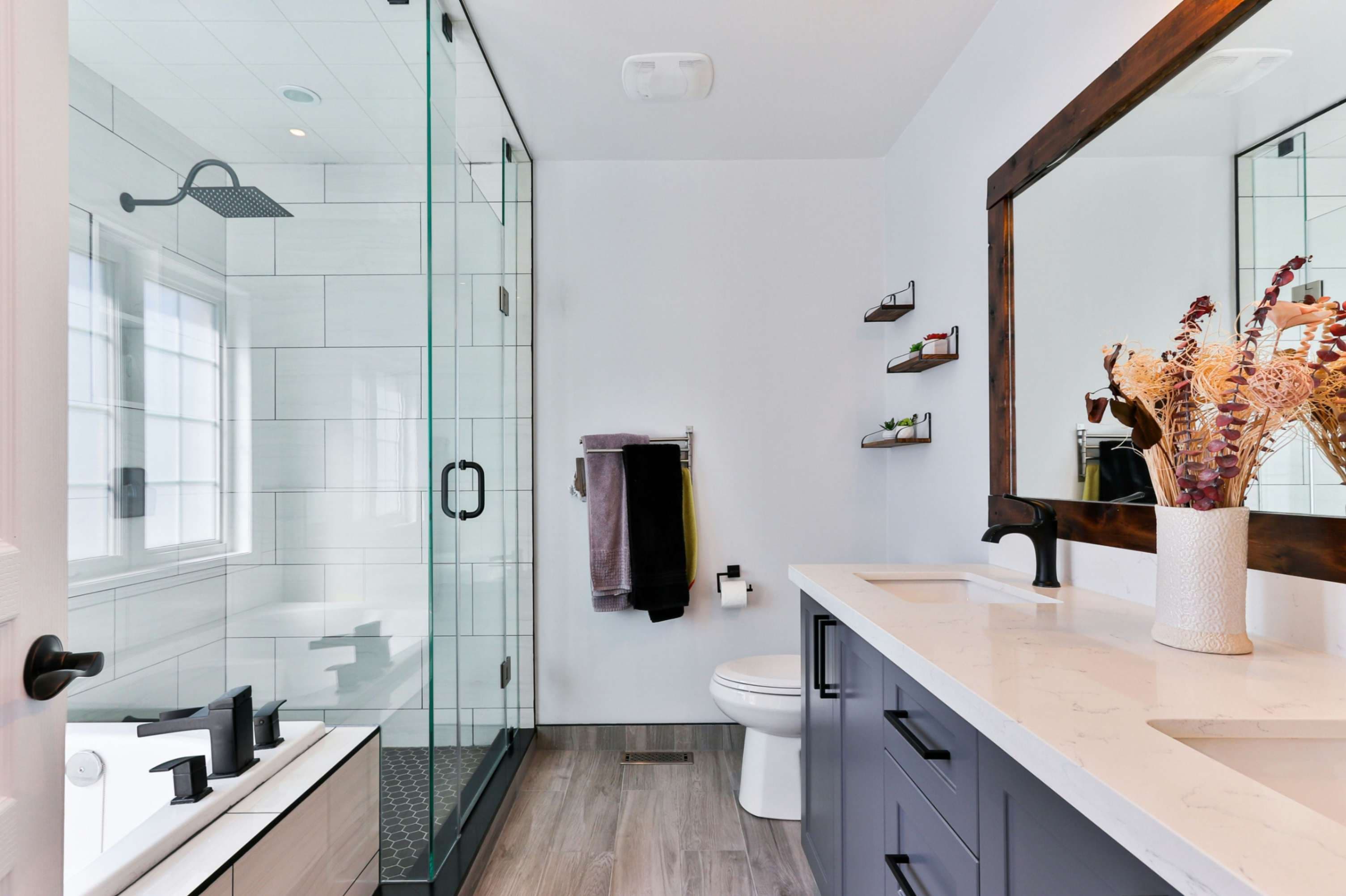 High-end spa-inspired bathroom transformation featuring standalone bathtub by Prime Bath Studio